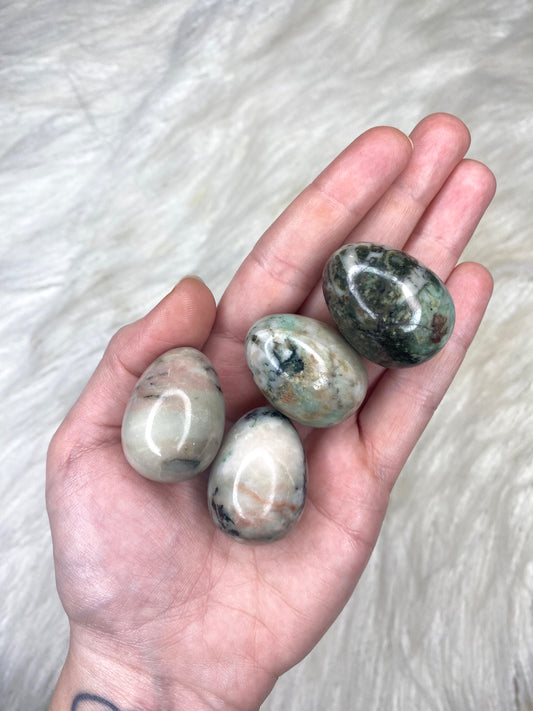 Emerald In Quartz Egg Carving