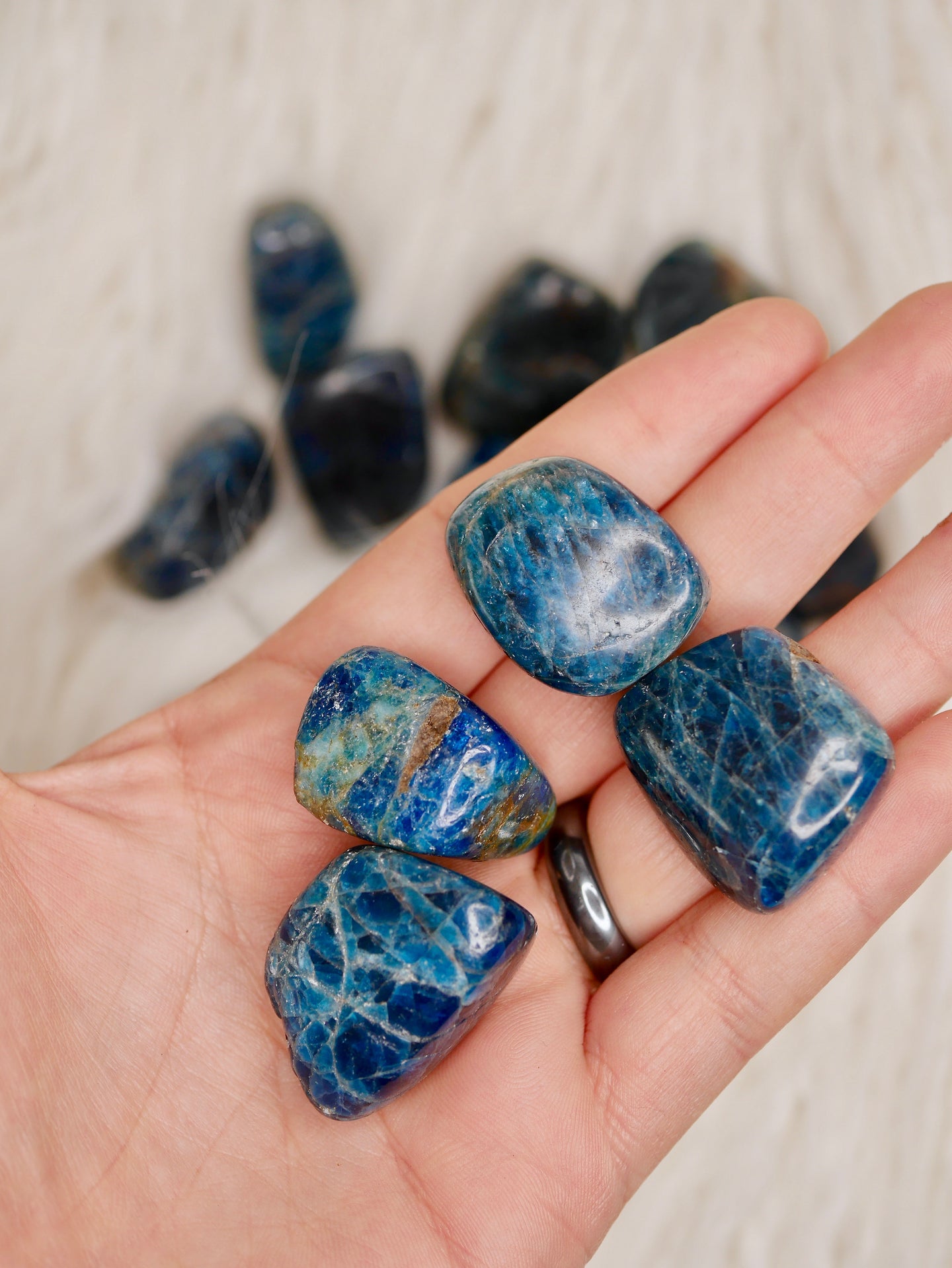 Blue apatite tumbled stones